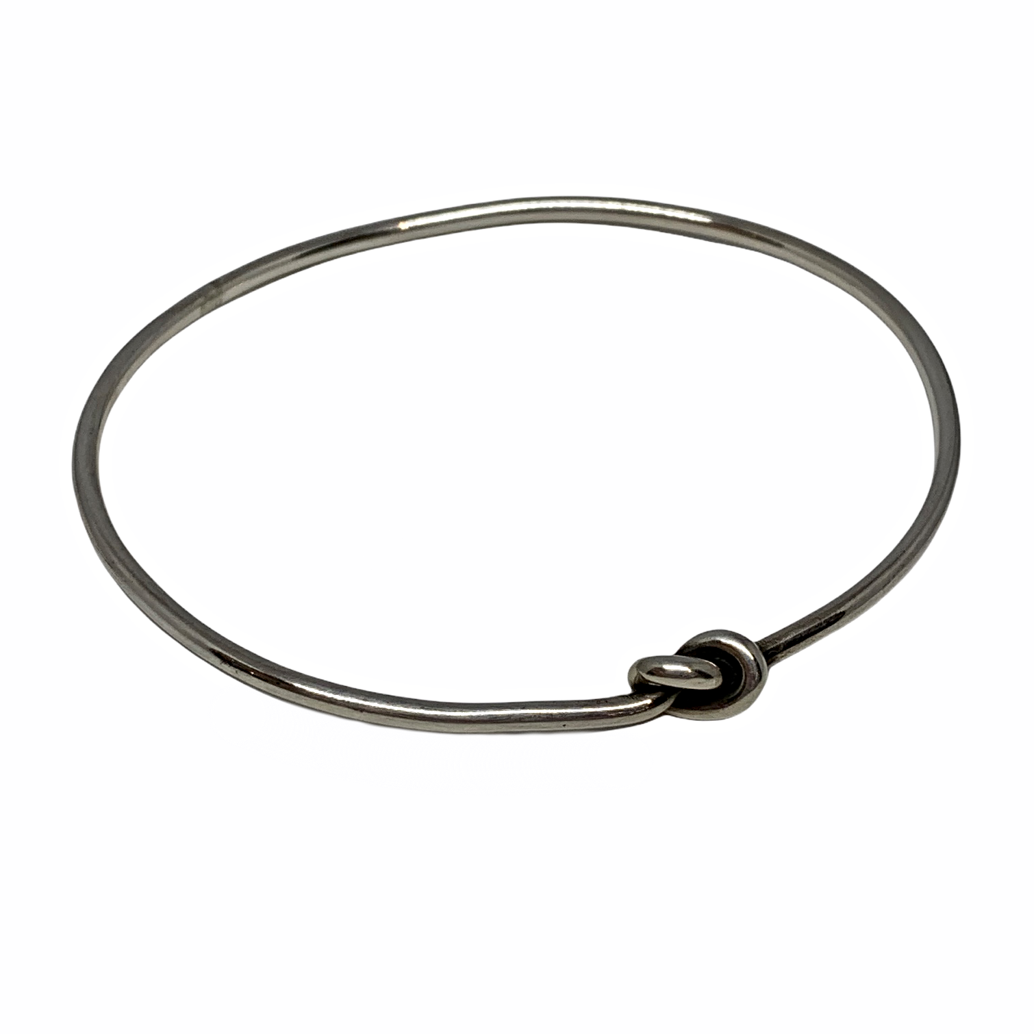 Handmade sterling silver love knot bangle by Karyn Chopik | Effusion Art Gallery + Cast Glass Studio, Invermere BC