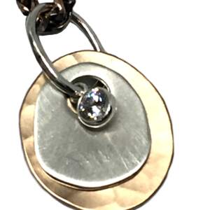 Bronze, sterling silver, and CZ pendant by Karyn Chopik | Effusion Art Gallery + Cast Glass Studio, Invermere BC
