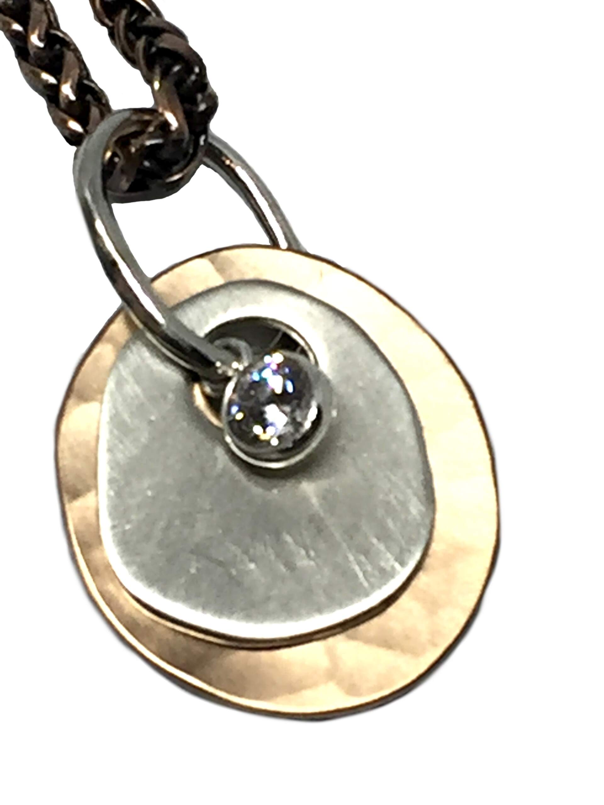 Bronze, sterling silver, and CZ pendant by Karyn Chopik | Effusion Art Gallery + Cast Glass Studio, Invermere BC