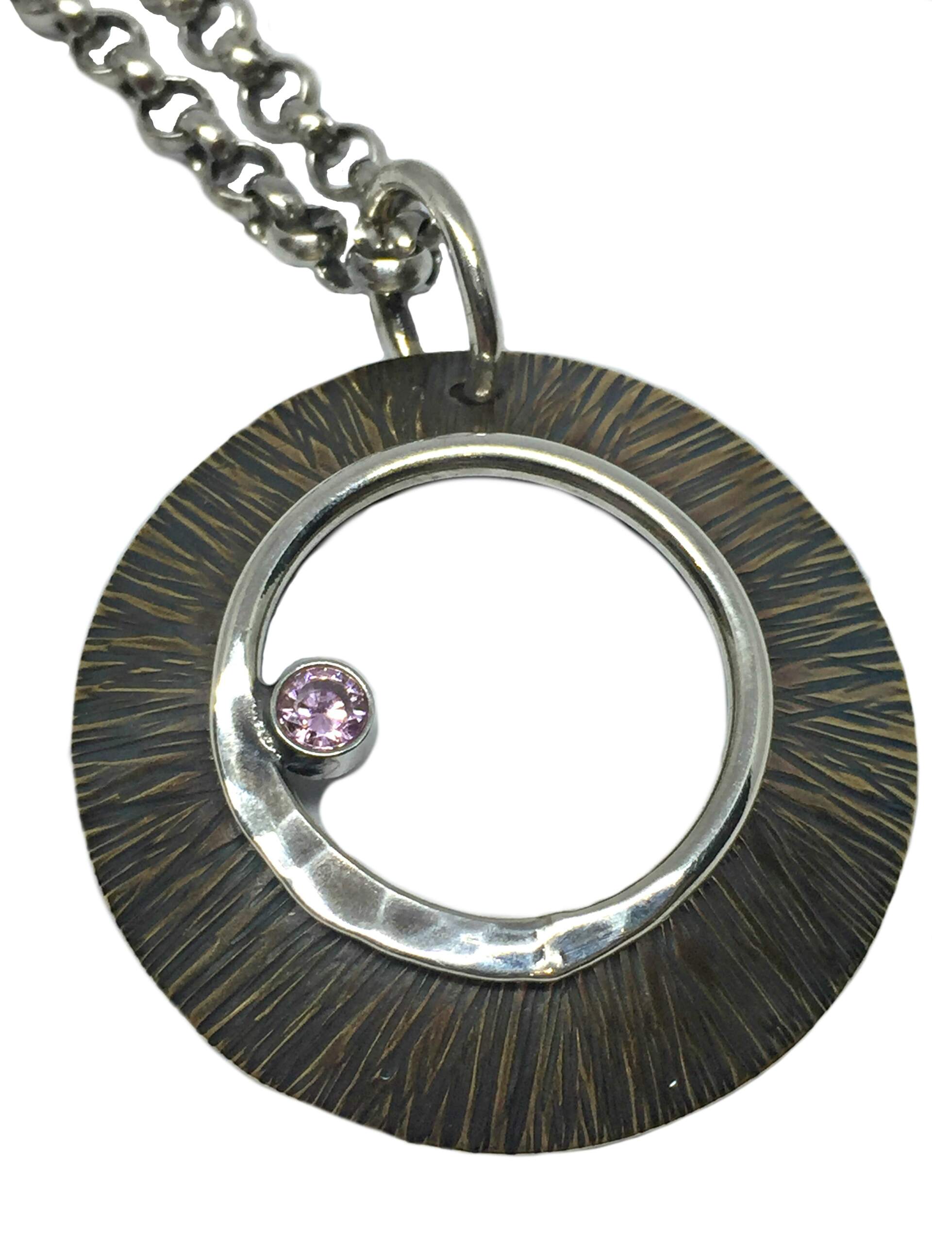 Bronze, sterling silver, + pink CZ pendant by Karyn Chopik | Effusion Art Gallery + Cast Glass Studio, Invermere BC