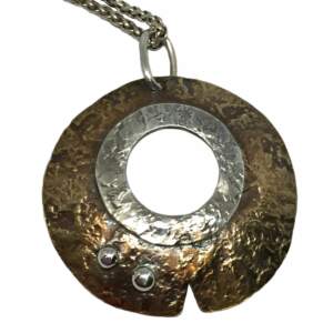 Sterling and bronze pendant by Karyn Chopik | Effusion Art gallery + Cast Glass Studio, Invermere BC