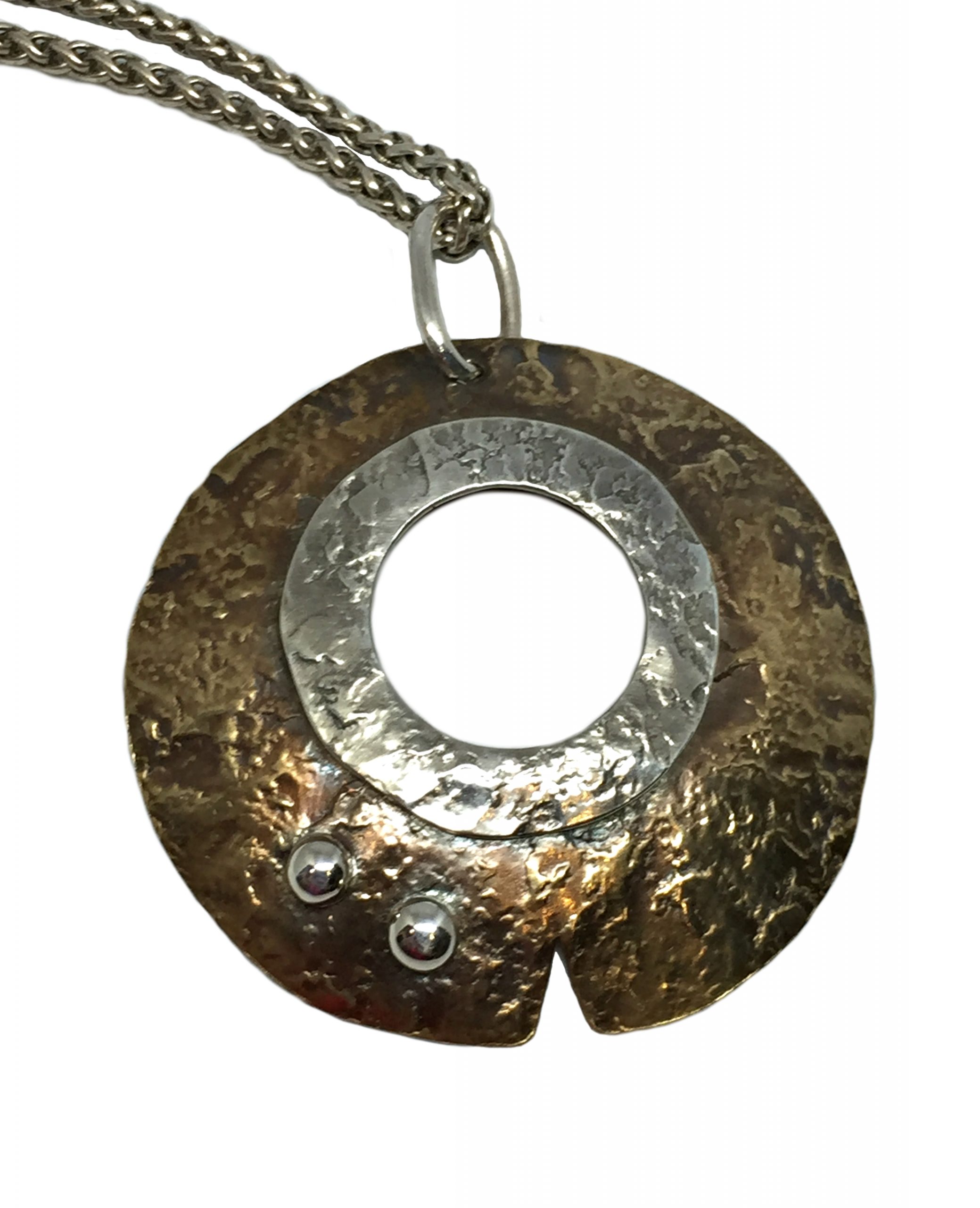 Sterling and bronze pendant by Karyn Chopik | Effusion Art gallery + Cast Glass Studio, Invermere BC
