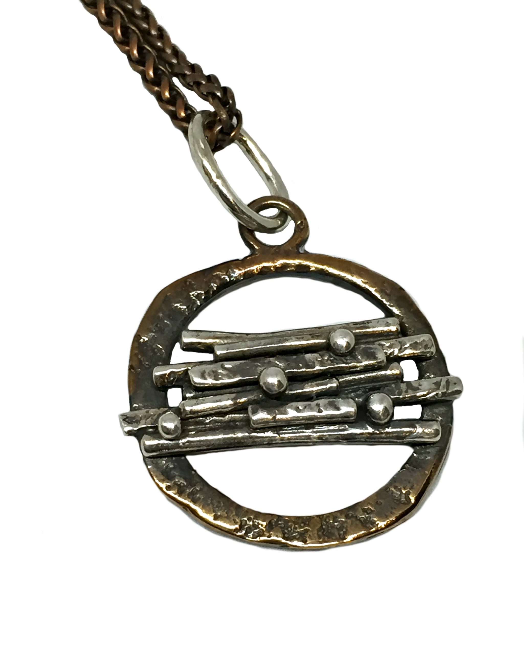 Sterling and bronze pendant by Karyn Chopik | Effusion Art gallery + Cast Glass Studio, Invermere BC