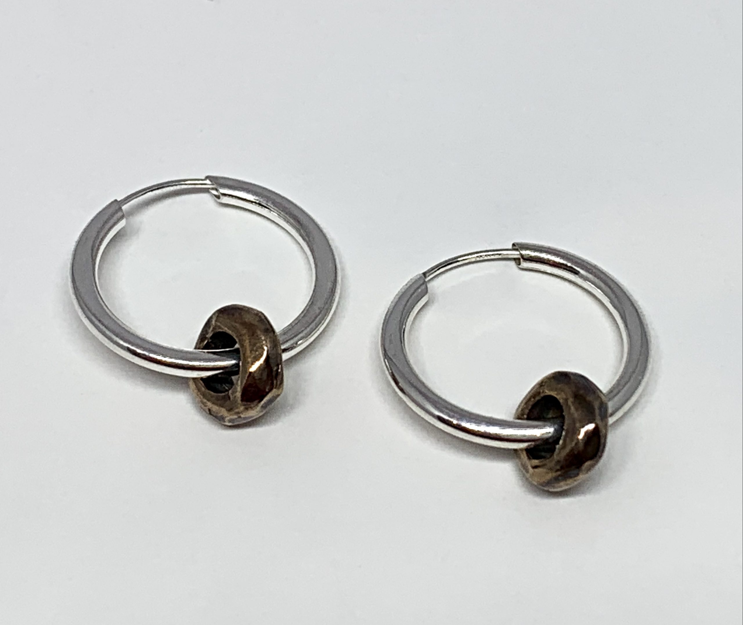 Sterling silver and bronze hoop earrings by Karyn Chopik | Effusion Art Gallery + Cast Glass Studio, Invermere BC