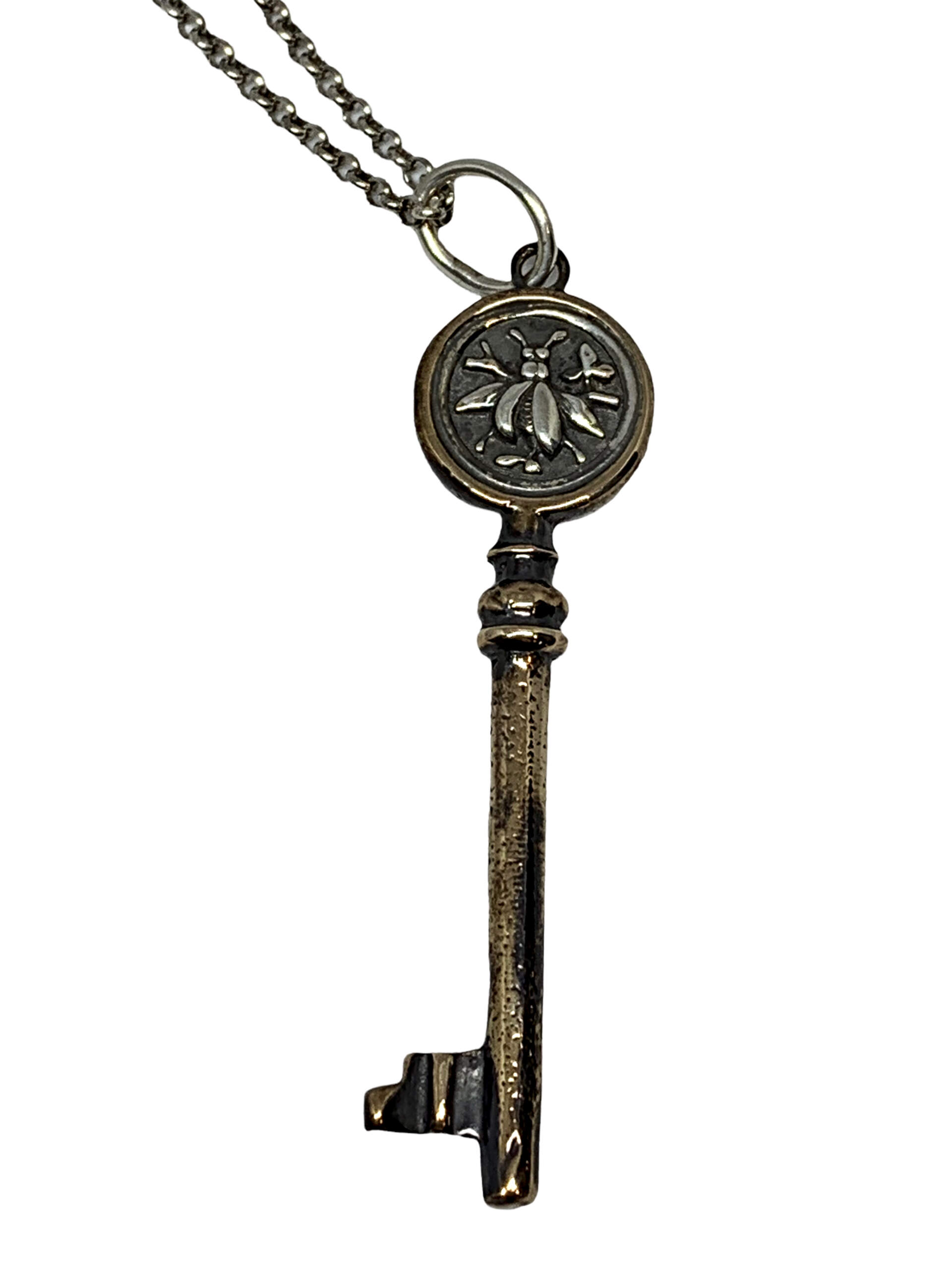 Handmade bronze and sterling silver bee key pendant by Karyn Chopik | Effusion Art Gallery + Cast Glass Studio, Invermere BC