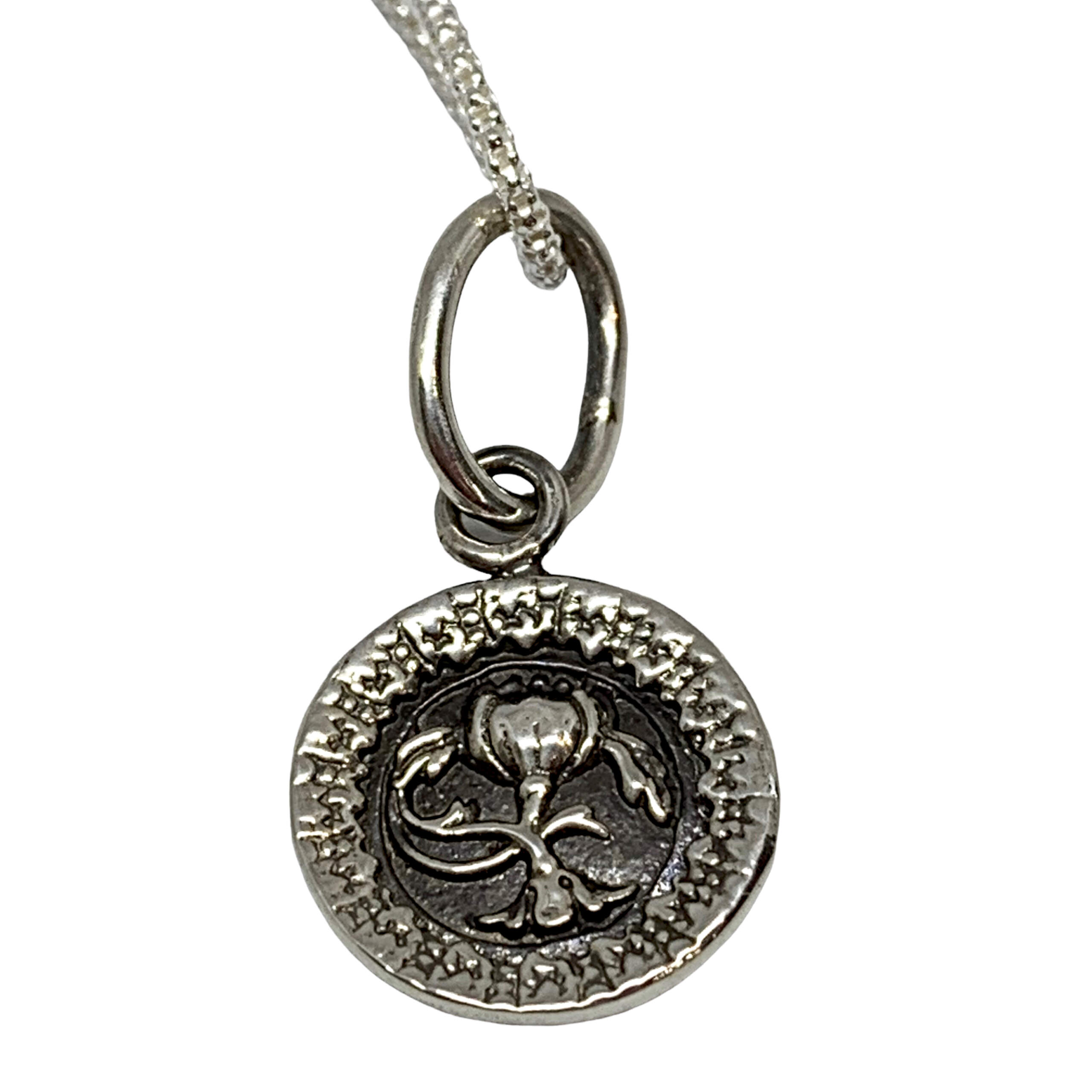 Handmade sterling silver flower pendant by Karyn Chopik | Effusion Art Gallery + Cast Glass Studio, Invermere BC
