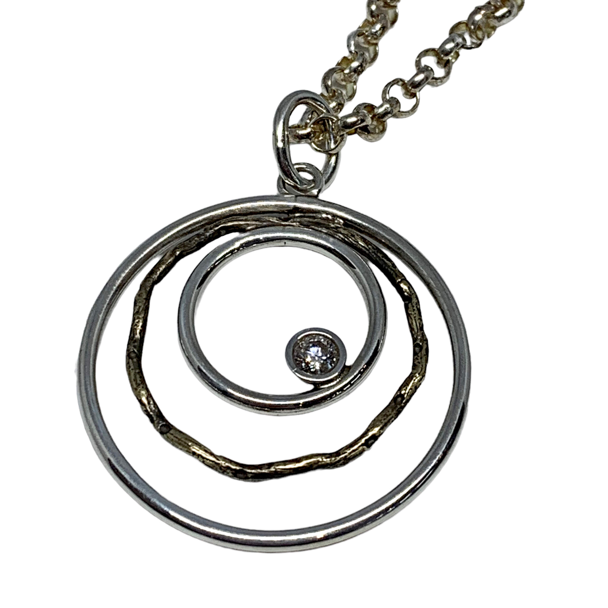 Handmade bronze, sterling silver, + CZ pendant by Karyn Chopik | Effusion Art Gallery + Cast Glass Studio, Invermere BC