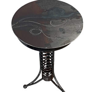 Side Table 2, reclaimed steel side table with a swirled pattern on the top and a steampunk, spiral metal base by Wendy Stone at Effusion Art Gallery in Invermere.