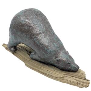 Sculpture of a whimsical friendly bear in the downward dog yoga pose on a driftwood yoga mat, with a bronze patina finish by Karin Taylor.