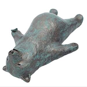 Sculpture of a whimsical friendly bear laying down doing Savasana yoga and a butterfly on his paw with a bronze patina finish by Karin Taylor.