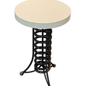 Reclaimed metal side table with a black spiral base and round cream top by artist Wendy Stone.