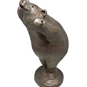 Mixed media sculpture of a bear with a butterfly on his nose in the yoga chair pose by Karin Taylor.