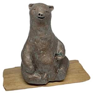 Mixed media sculpture of a bear sitting on a yoga mat by Karin Taylor.