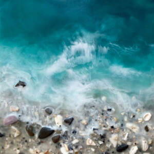 Original encaustic painting of a turquoise ocean with a real, textured sand, rock, and shell beach by Brenda Walker.