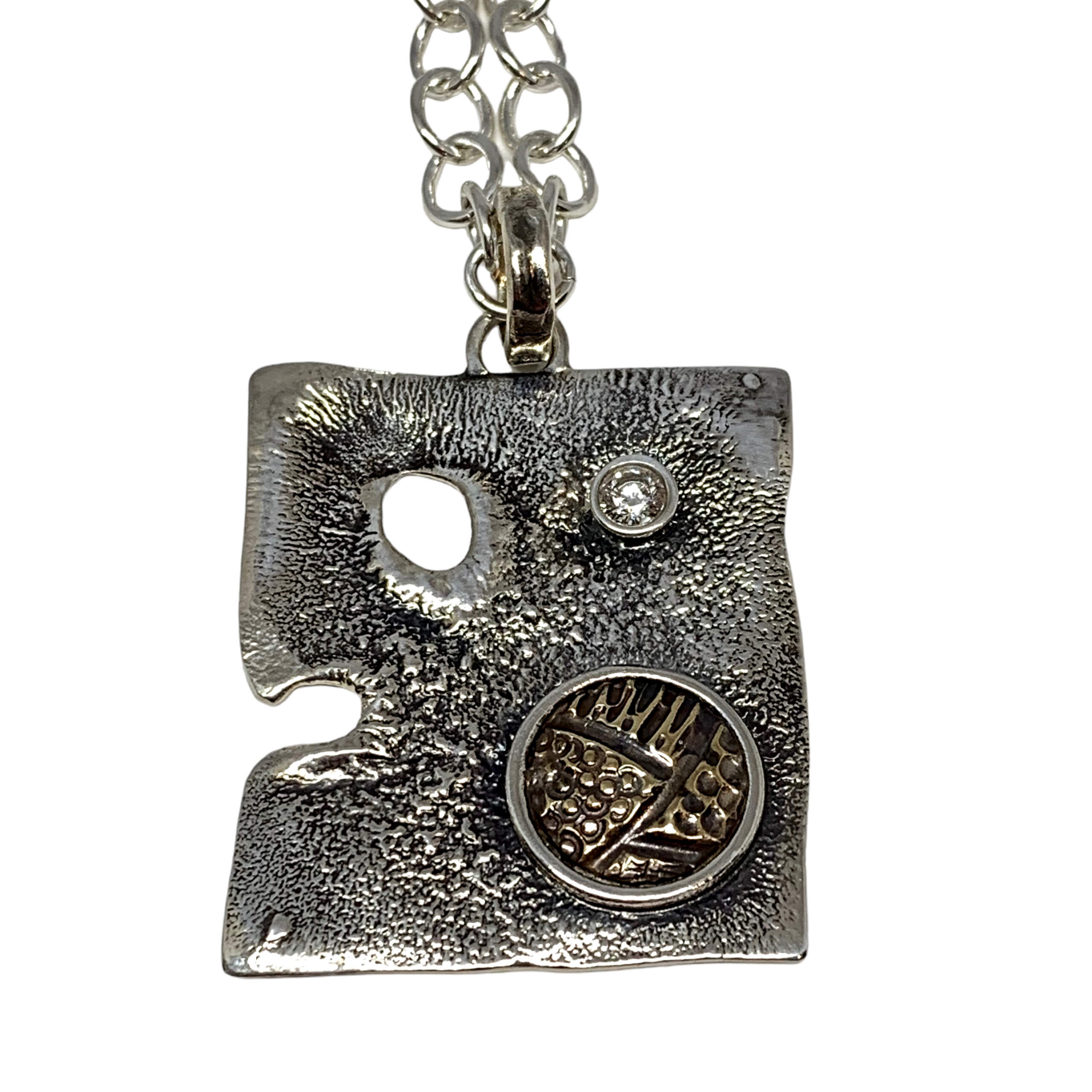 Handmade sterling silver, bronze, + CZ pendant by Karyn Chopik | Effusion Art Gallery, Invermere, BC