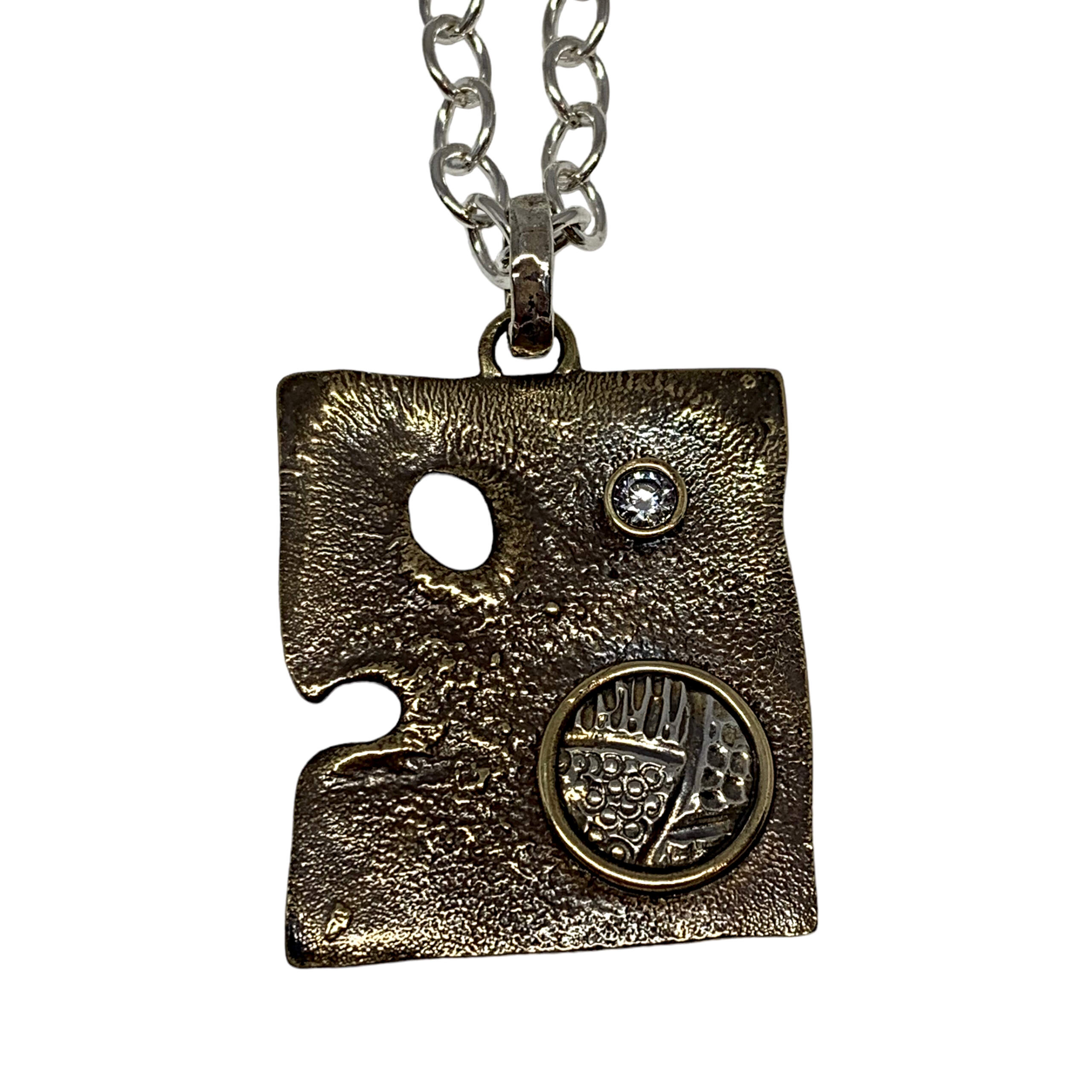 Handmade sterling silver, bronze, + CZ pendant by Karyn Chopik | Effusion Art Gallery, Invermere, BC
