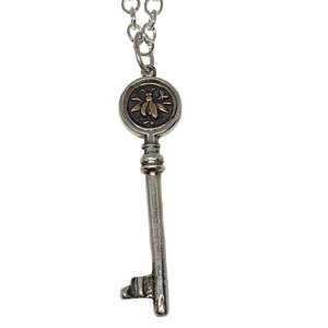 Handmade sterling silver and bronze bee key pendant by Karyn Chopik | Effusion Art Gallery, Invermere, BC