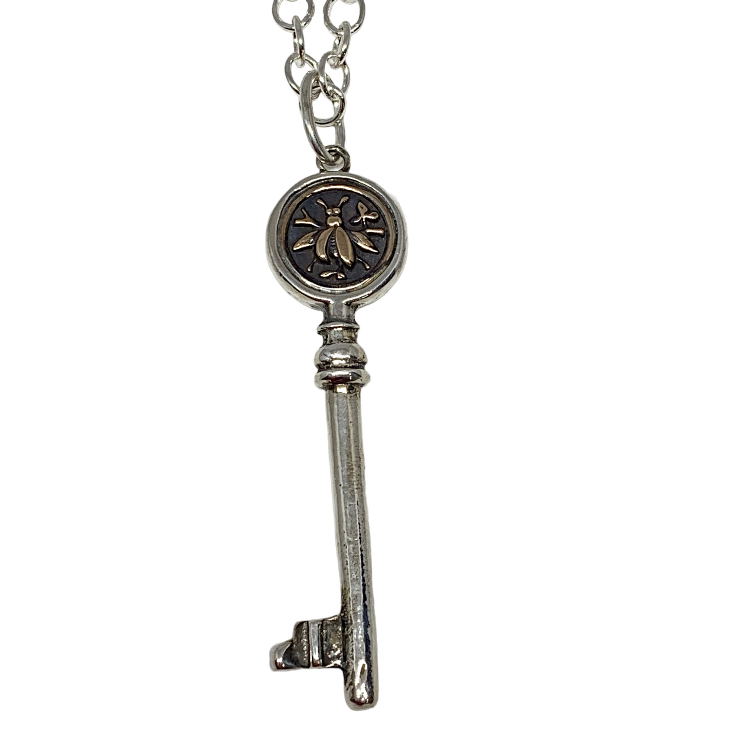 Handmade sterling silver and bronze bee key pendant by Karyn Chopik | Effusion Art Gallery, Invermere, BC
