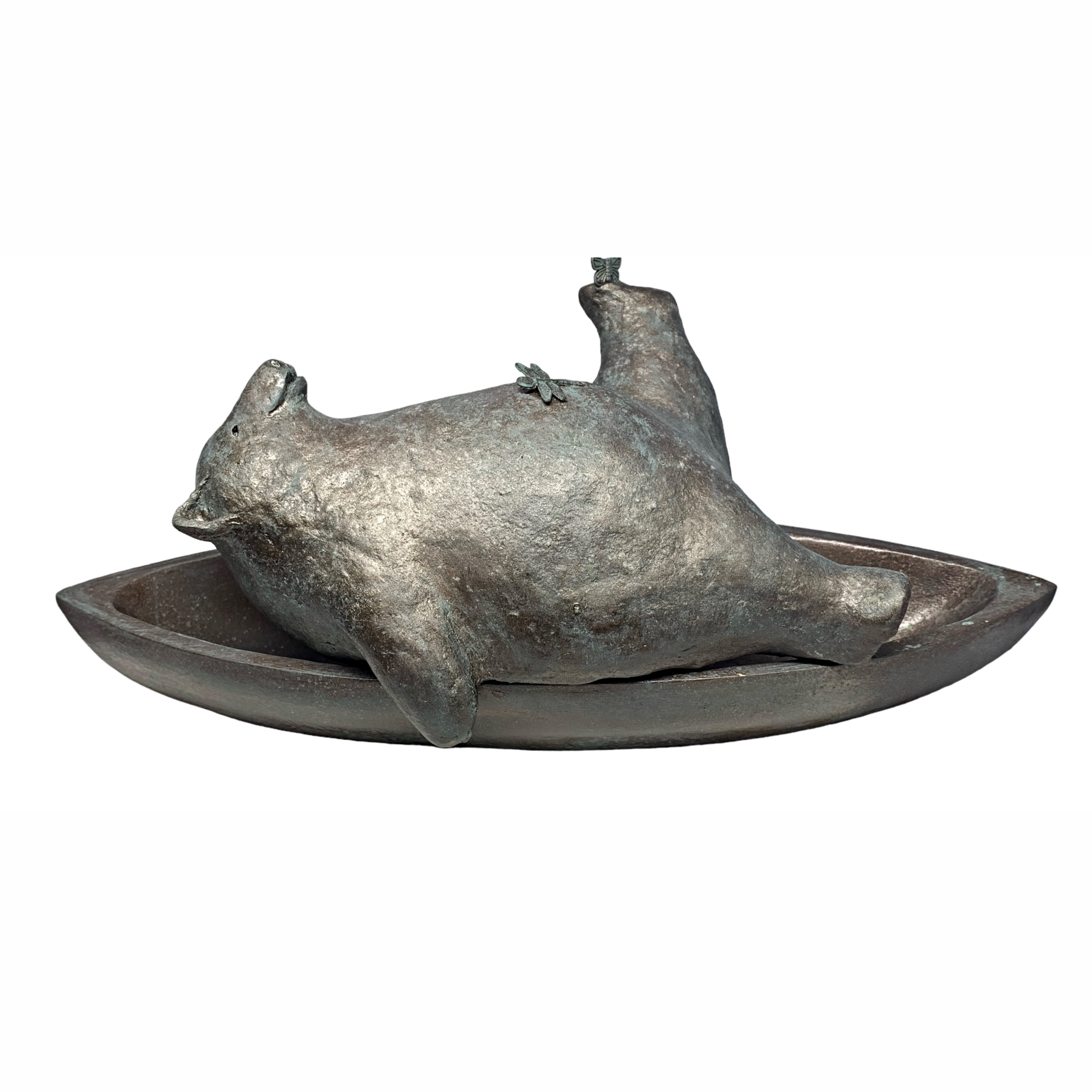 Living the Dream, cute mixed media bear sculpture relaxing in a canoe by Karin Taylor at Effusion Art Gallery in Invermere, BC.