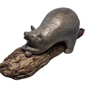 Original mixed media sculpture of a cute bear resting on a piece of driftwood with her butterfly friends by Karin Taylor.