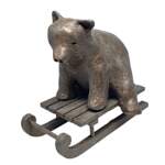 Sleigh Bear, cute mixed media sledding bear sculpture by Karin Taylor at Effusion Art Gallery in Invermere, BC.