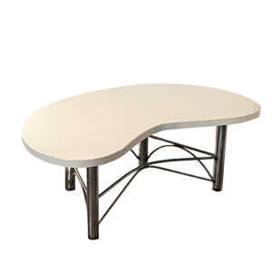 Modern kidney shaped metal coffee table with a cream top and curved steel legs by Wendy Stone.
