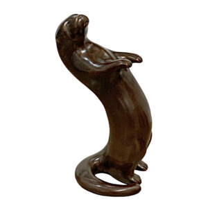 In the Groove, original cast bronze dancing otter sculpture by Canadian artist Cathryn Jenkins at Effusion Art Gallery in Invermere, BC.