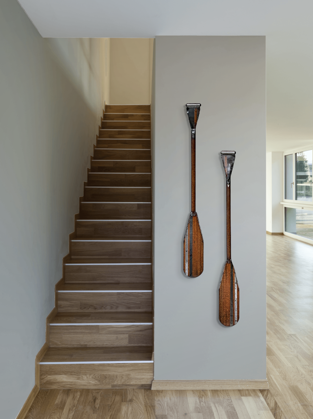 Racing Stripes 1 + 2, one-of-a-kind reclaimed metal canoe paddle wall sculptures by Canadian artist Wendy Stone at Effusion Art Gallery in Invermere, BC.