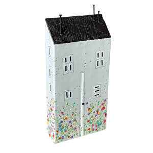 3-D encaustic painting of a cute light grey house with a white door, black sloped roof, colorful flowers, and nail chimney and door knob by Brenda Walker.
