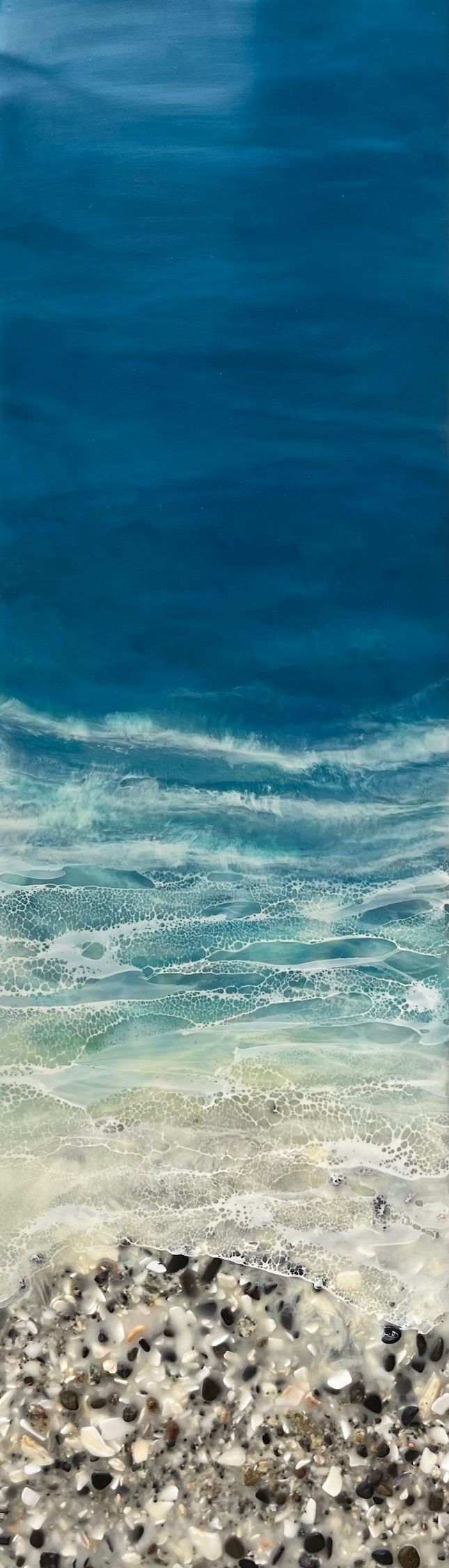 Original encaustic and rock beach and blue water painting by Canadian artist Brenda Walker at Effusion Art Gallery in Invermere, BC.