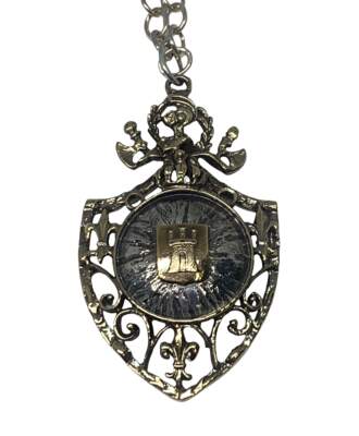 Sterling silver + bronze pendant by Karyn Chopik at Effusion Art Gallery in Invermere, BC.