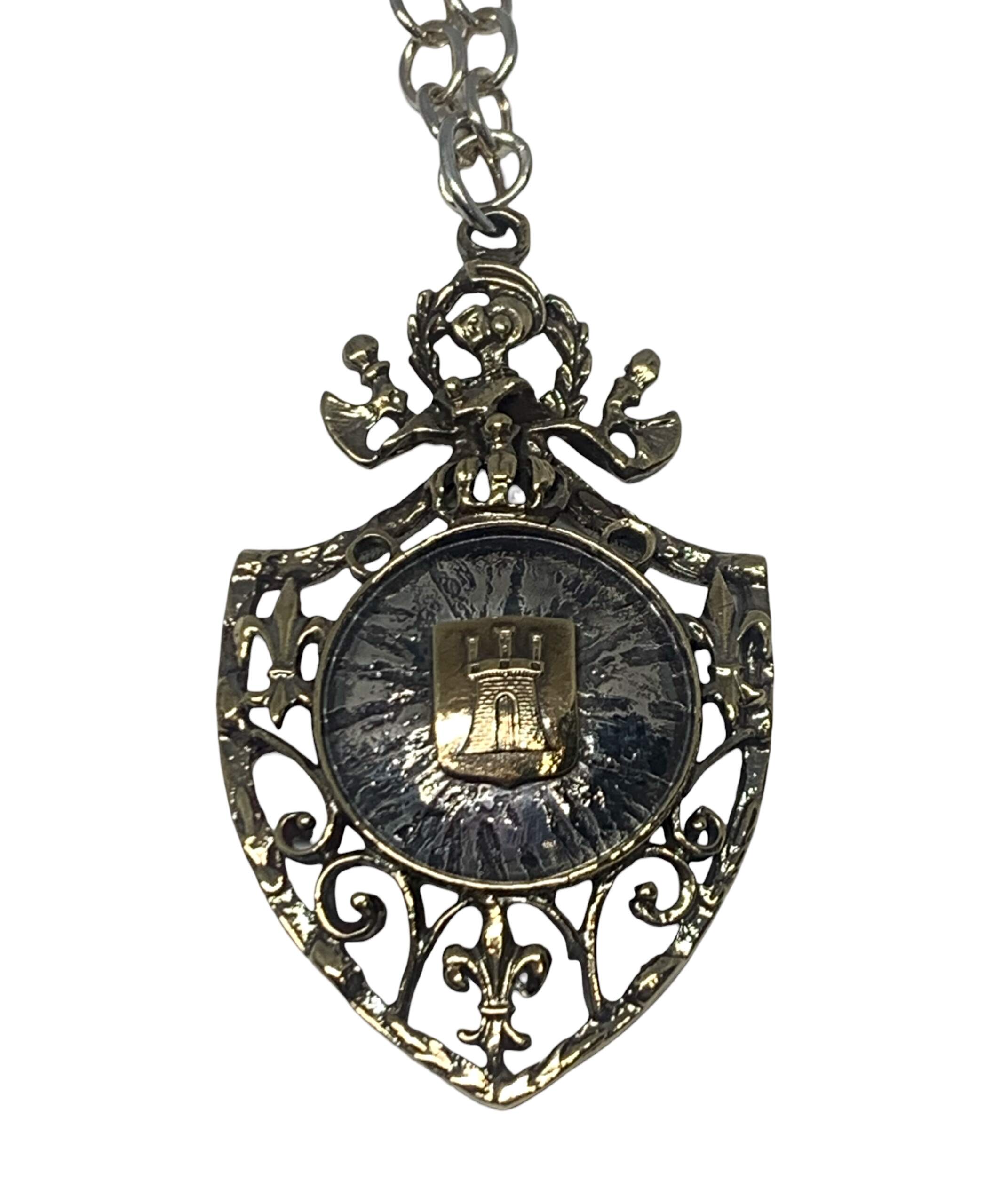 Sterling silver + bronze pendant by Karyn Chopik at Effusion Art Gallery in Invermere, BC.