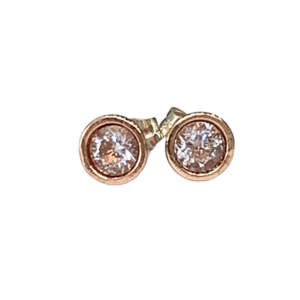 Handmade pink bronze, sterling silver, and CZ stud earrings by Karyn Chopik at Effusion Art Gallery in Invermere, BC.
