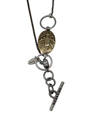 Lamp Lighter Necklace, one of a kind reversible sterling silver + bronze necklace by Karyn Chopik at Effusion Art Gallery in Invermere, BC.