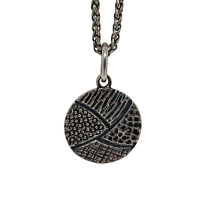 Handmade sterling silver pendant by Karyn Chopik Jewelry at Effusion Art Gallery in Invermere, BC.