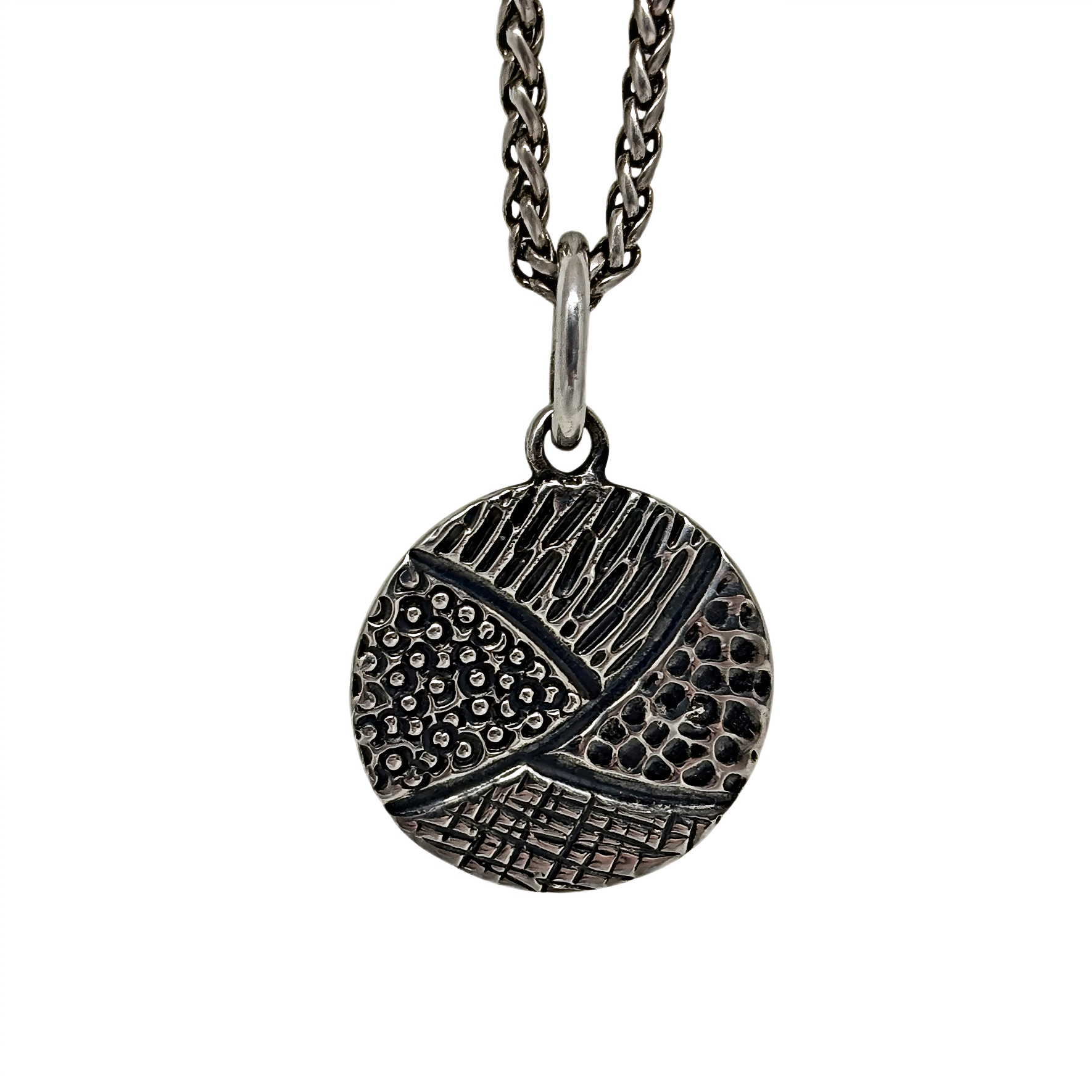 Handmade sterling silver pendant by Karyn Chopik Jewelry at Effusion Art Gallery in Invermere, BC.