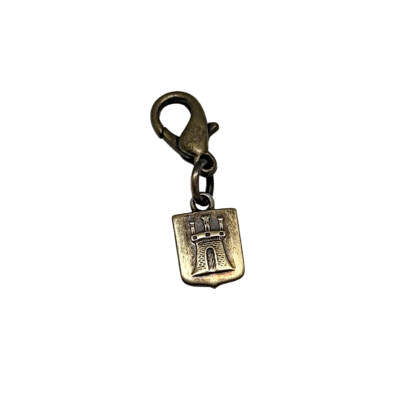 Handmade bronze mini click pendant by Karyn Chopik Jewelry at Effusion Art Gallery in Invermere, BC.