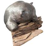 Nap Attack Cub, original mixed media sculpture of a cute bear cub napping on a piece of driftwood by Canadian artist Karin Taylor at Effusion Art Gallery in Invermere, BC.