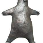 Sea Star Savasana, original mixed media sculpture of a cute bear in the savasana yoga post with his starfish, sand dollar, and dragonfly friends by Canadian artist Karin Taylor at Effusion Art Gallery in Invermere, BC.