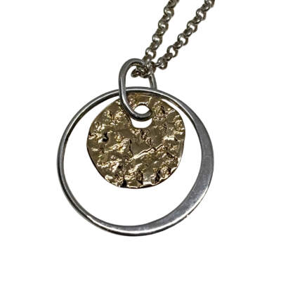 Handmade sterling silver and bronze pendant by Canadian jewelry artist Karyn Chopik at Effusion Art Gallery in Invermere, BC.