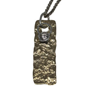 Handmade bronze, sterling silver, + 6mm cubic zirconia pendant by Canadian jewelry artist Karyn Chopik at Effusion Art Gallery in Invermere, BC.