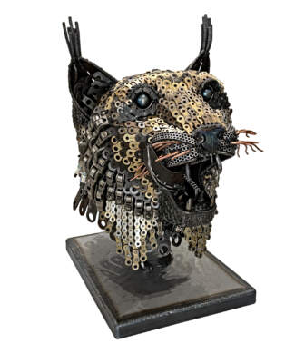 Show Me the Bunny, original reclaimed steel lynx sculpture by Canadian metal artist Wendy Stone at Effusion Art Gallery in Invermere, BC.