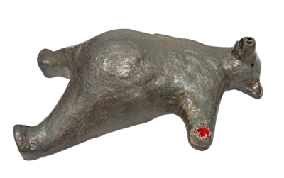 Canadian Savasana Bear, original mixed media sculpture of a friendly bear in the savasana yoga pose with a maple leaf by Canadian artist Karin Taylor at Effusion Art Gallery in Invermere, BC.