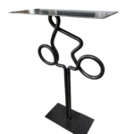 Clear View 1, one-of-a-kind steel cyclist table by Canadian metal artist Paul Reimer at Effusion Art Gallery in Invermere, BC.