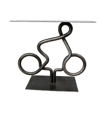 Clear View 2, one-of-a-kind steel cyclist table by Canadian metal artist Paul Reimer at Effusion Art Gallery in Invermere, BC.